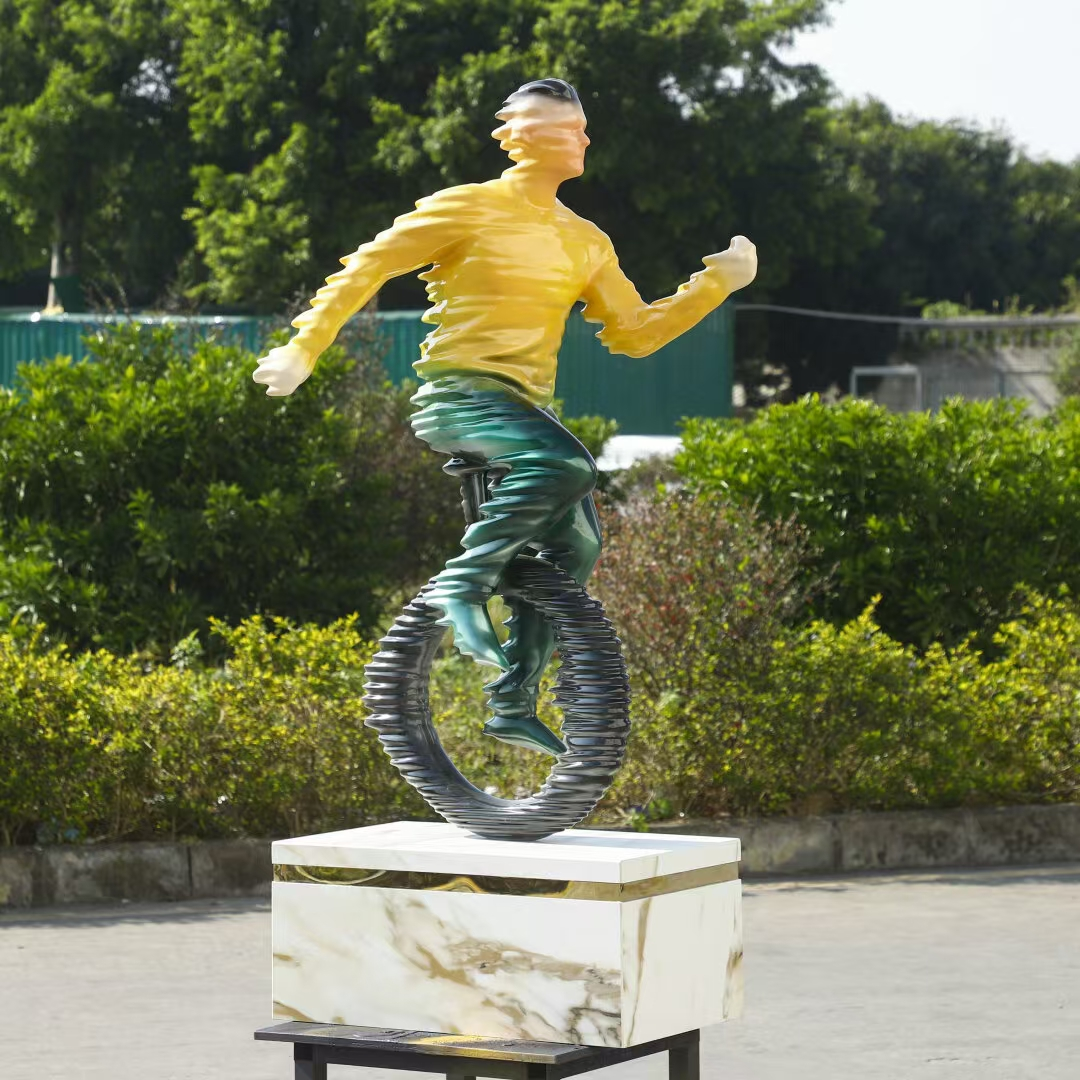 Finished abstract running figure sculpture with a circular structure and pedestal base